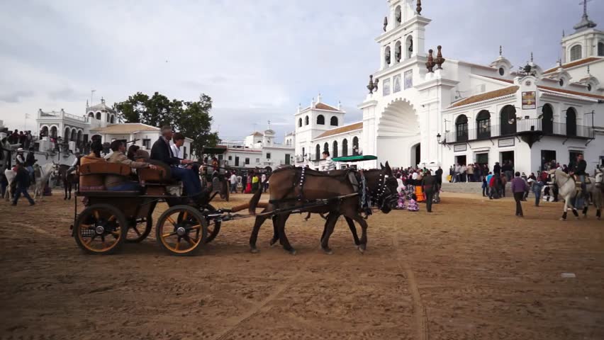 El ROCIO, ANDALUCIA, SPAIN - MAY 19: Pilgrims, people attend to the Sanctuario de Nuestra Senora de El Rocio in one of the most famous religious pilgrimage of Spain. May 19, 2013 in el Rocio, Spain