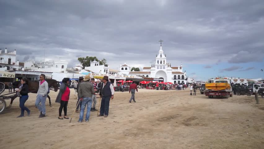 El ROCIO, ANDALUCIA, SPAIN - MAY 19: Pilgrims, people attend to the Sanctuario de Nuestra Senora de El Rocio in one of the most famous religious pilgrimage of Spain. May 19, 2013 in el Rocio, Spain