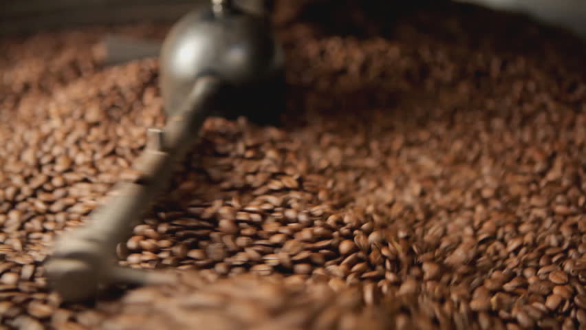traditional coffee roaster cooling off fresh roasted coffee beans