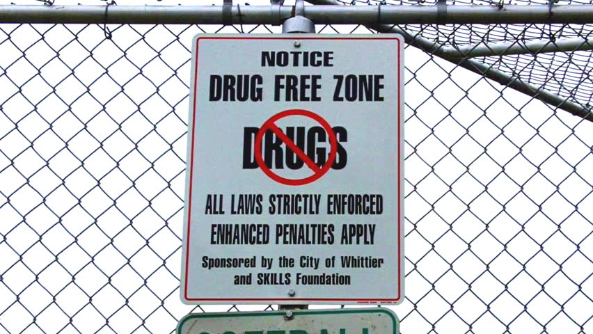 WHITTIER, CA - April 14, 2013. Shot of a city park drug free zone sign circa 2013 in Whittier. The sign advises of enhanced penalties for drug possession and usage in this zone.