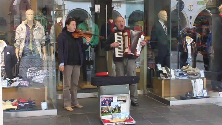 MUENSTER, GERMANY - MAY 9: Duo of street artists plays famous russian songs on May 9, 2013 in Muenster, Germany