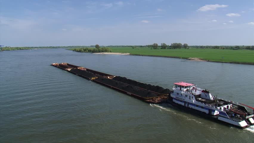 Towboat pushing barges upstream river Rhine. High angle view from Emmerich Rhine Bridge.