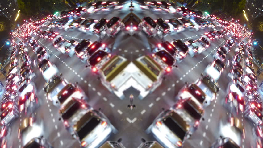 Traffic in the city. Avenue Time-Lapse, symmetric / mirrored, Night. Moon going down. Heavy traffic / jam / flowing with blurred motion.