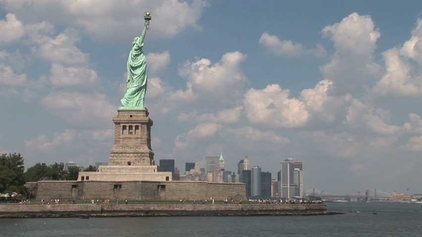 New York - MAY 16 2009: Tourists are starting to return to popular vacation spots like the Statue of Liberty after the world wide recession starts showing signs of recovery. 