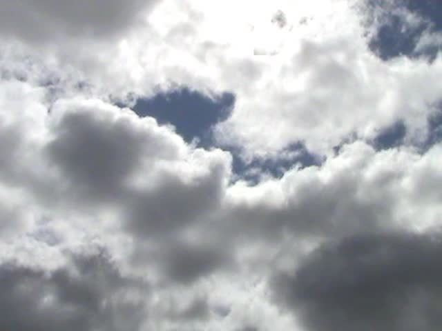  Time lapse sequence of morphing white clouds over a blue sky 