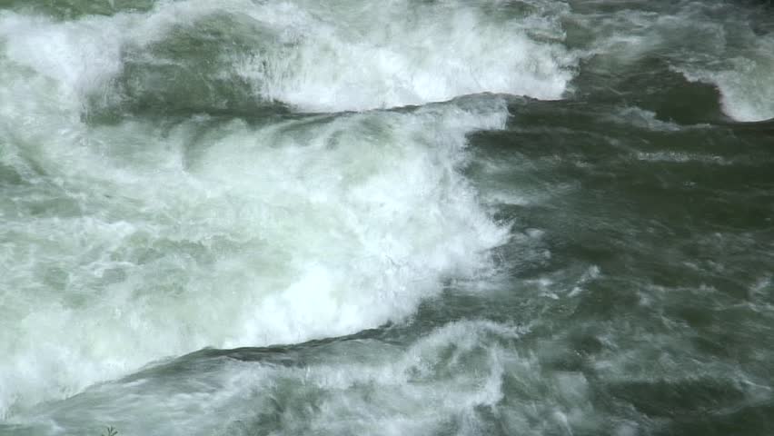 1080i, not rendered: Two rafting boats drifting on whitewater.Tripod.