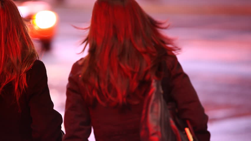Two young women trying to hold a cab on Times Square Manhattan, New York City / HD1080 / 29.97fps