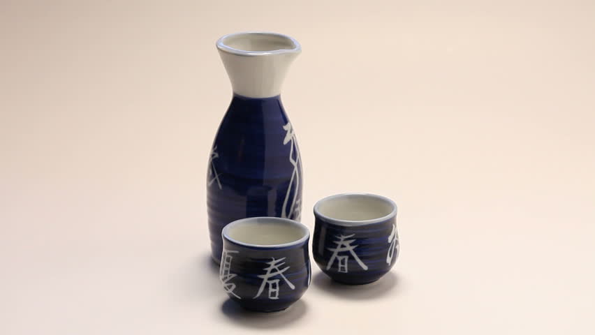 Sake pouring into cup.