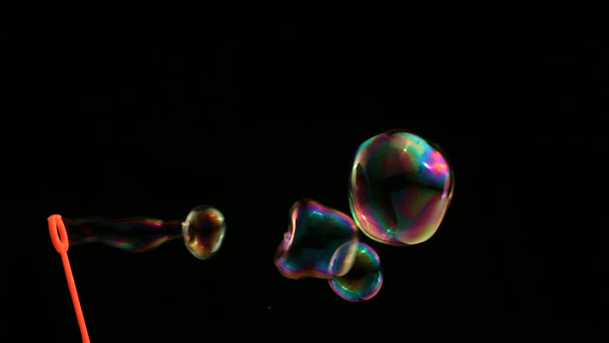 Colorful bubbles over black background