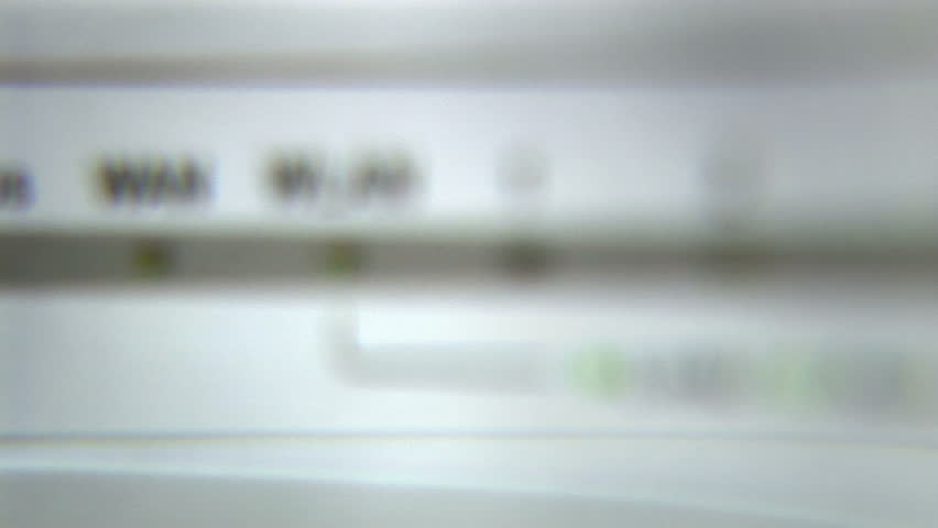 Ethernet router flashing lights from out-focus to in-focus.