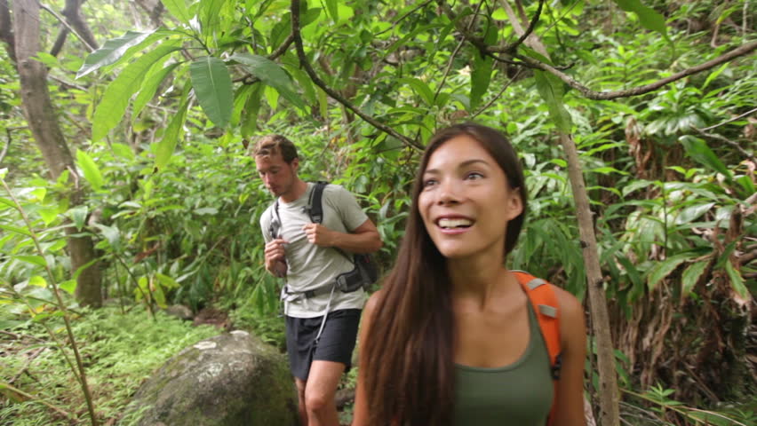 Hikers Walking In Rain Forest Jungle Hiking Couple Trekking Through Dense Rainforest Nature On