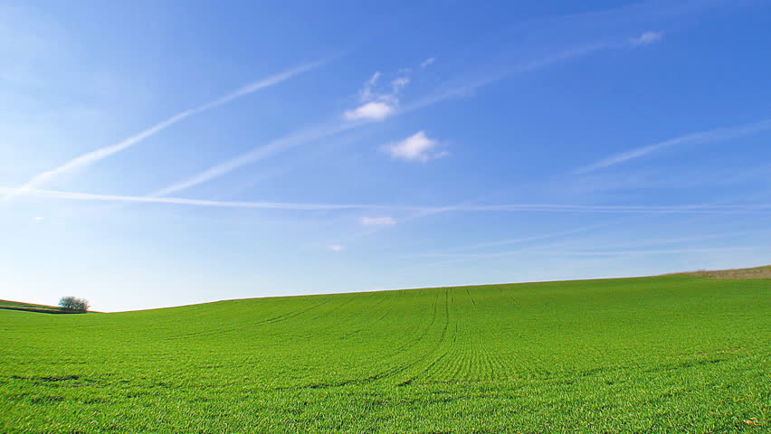 Time lapse, white clouds passing over green hills (windows xp background style !)