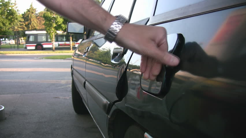 Pumping gas. Putting gasoline in the tank. 