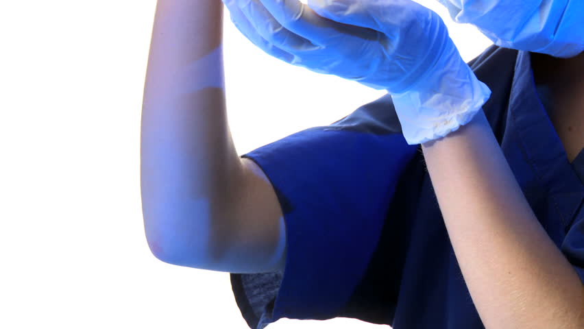 Close up of female scientist examines vial with blood 