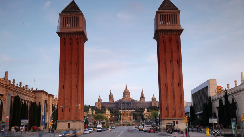 rush of traffic early evening, at plaza de espana, barcelona, spain