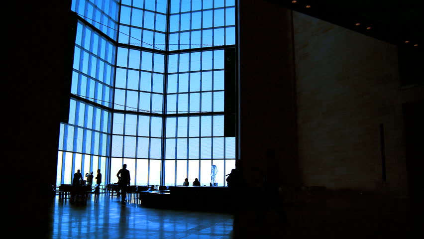 Silhouette of visitors inside an Islamic museum