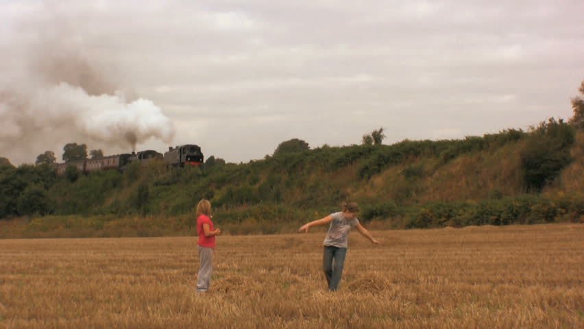 Children playing in a wheat field