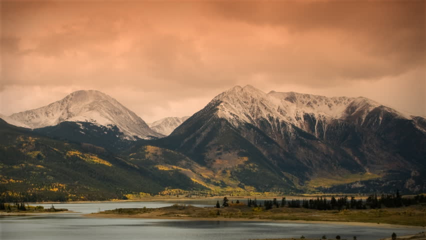 (1118) Autumn Early Snow Storm - Sunrise Timelapse of Mountains and Aspen. Great for themes of nature, travel, wilderness, seasons, weather, mountains, exploration, outdoor recreation, adventure.