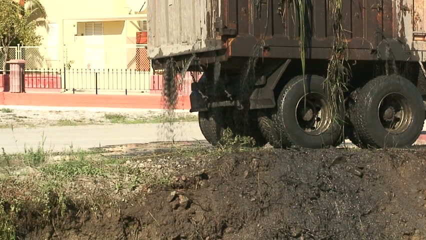 Silt from dredged canal leaking from lorry