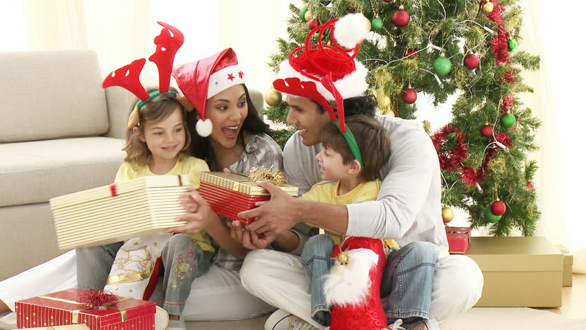 Family Opening Christmas Gifts At Home. Footage In High Definition Stock Footage Video 597424 