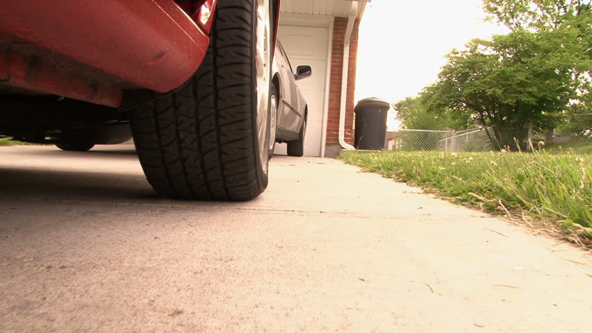 Car Backing up from Tire View