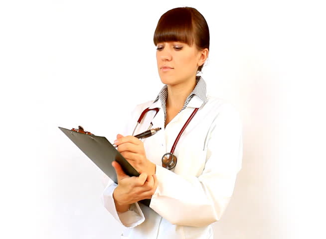 Female doctor recording something on notepad