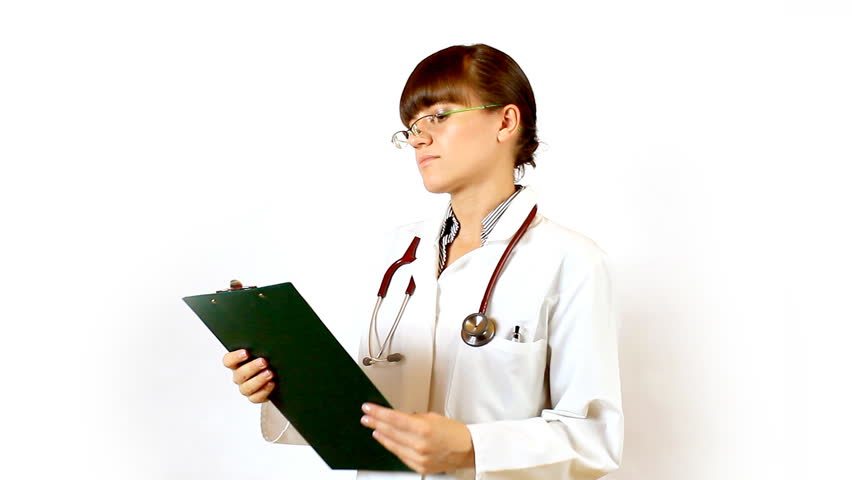 Female doctor recording something on notepad and prohibit
