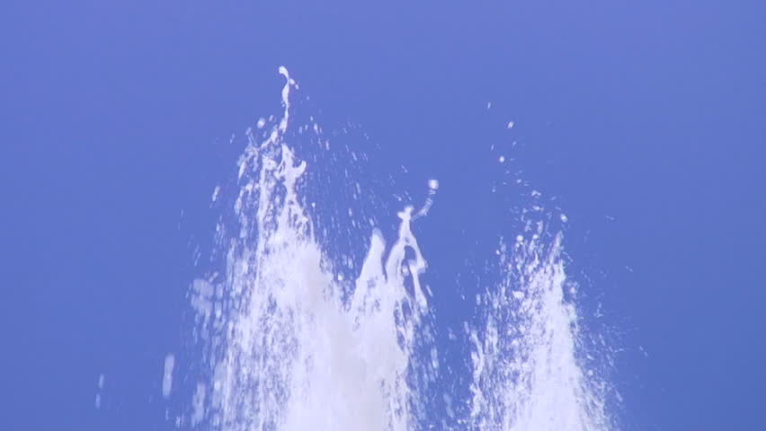 top of water fountain against clear sky