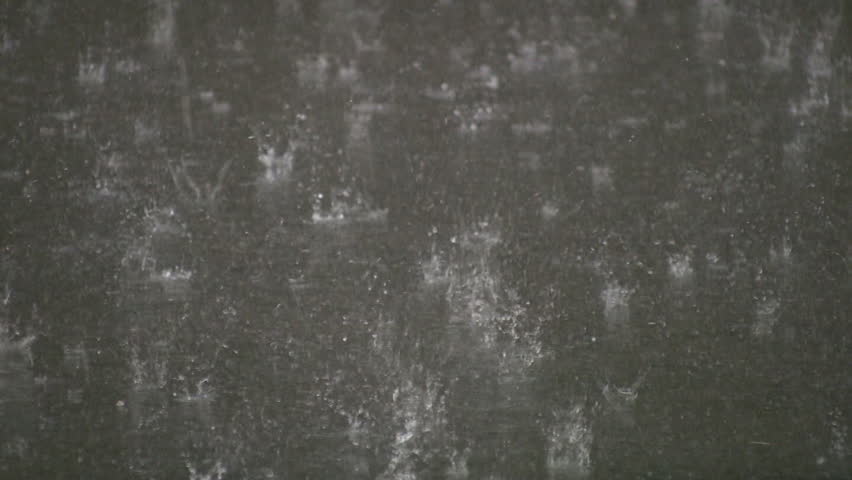Summer thunderstorm with heavy rain on asphalt surface. 3 shots.