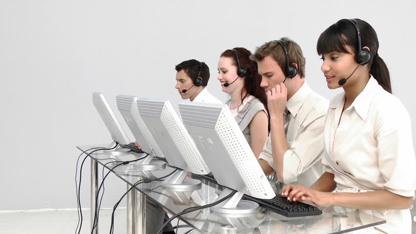 Multi-ethnic business people working in a call center with headset on
