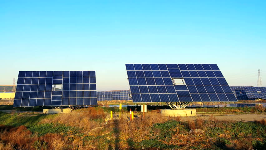 Farms of photovoltaic solar panels producing clean sustainable energy