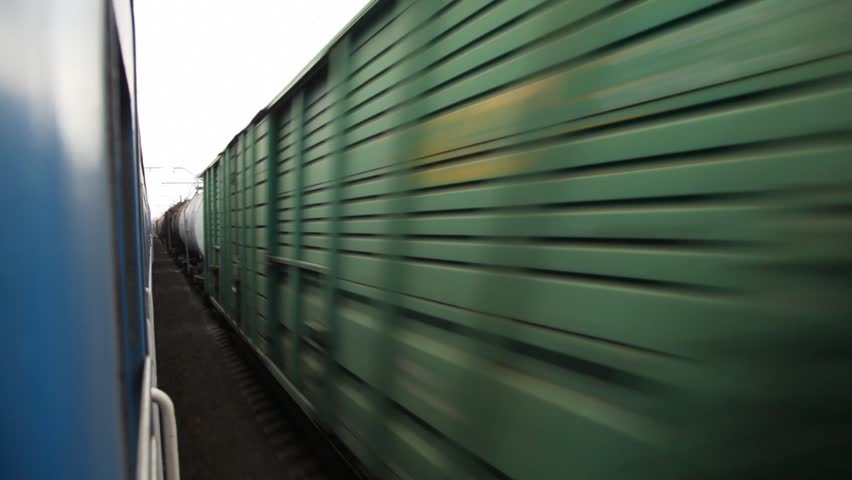 motion blurred freight train, view from train moving in an opposite direction 