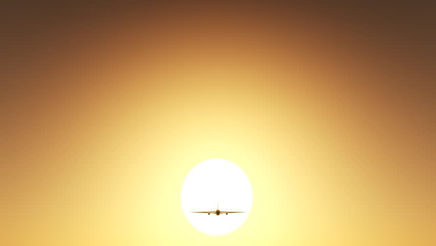Airplane flying in sunset sky.