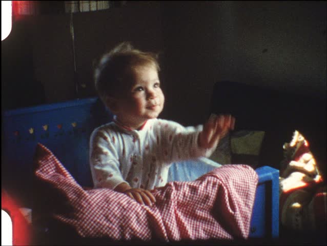 Baby in pen (vintage 8 mm amateur film)