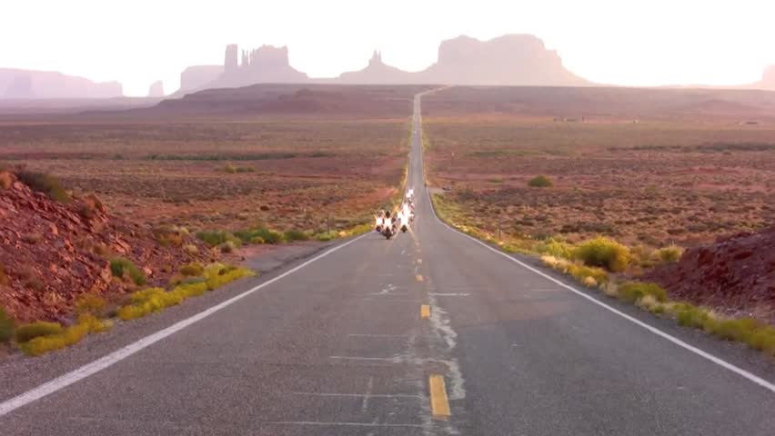 Motorcycles riding through Monument Valley