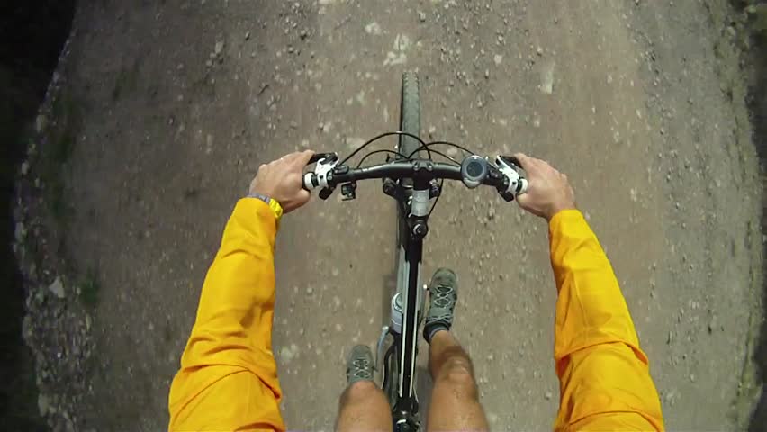 Man pedaling on a mountain bike 