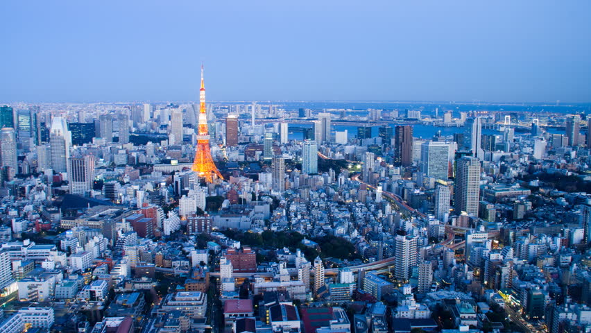 Traffic streaks through-out frame in wide shot of Tokyo, Japan, time-lapse