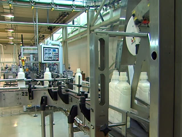 Industrial production of liquid detergent.Plastic bottles moving along the conveyor belt.