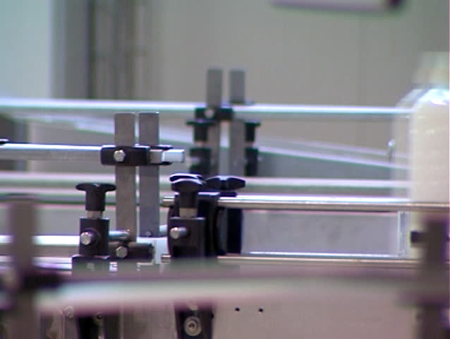 Plastic bottles moving along the conveyor belt.