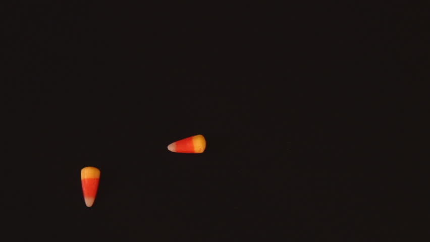 Stop motion animation of traditional Halloween candy corn forming the words "Happy Halloween" on black background-HD