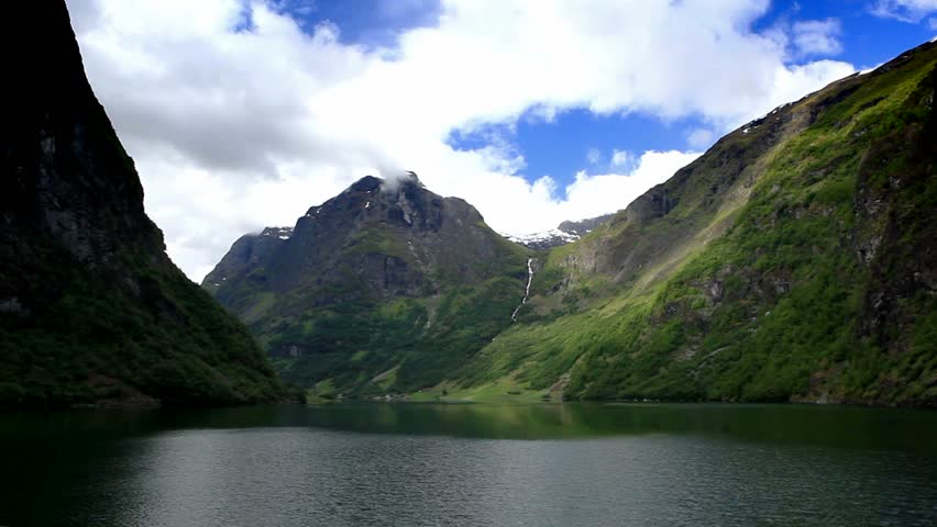Norway. Go by ship through the fjord.