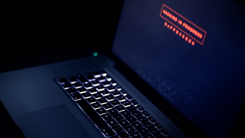 computer running a hacking program in the background