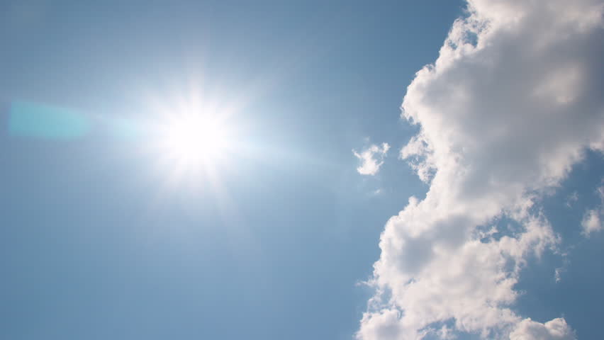 White clouds disappear in the hot sun on blue sky. Time-lapse motion background