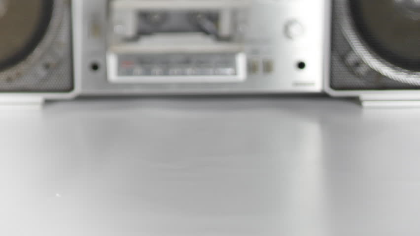 stopmotion of a fantastic looking retro ghetto blaster with cassette tape spilling out