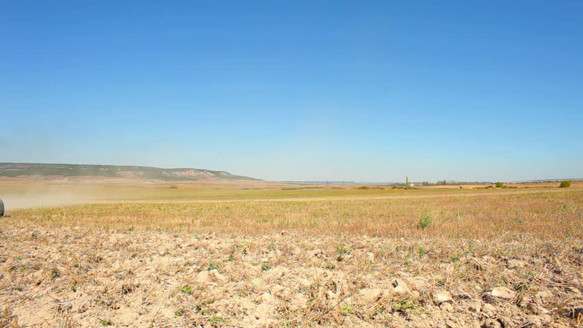 Tractor preparing field for sowing. 