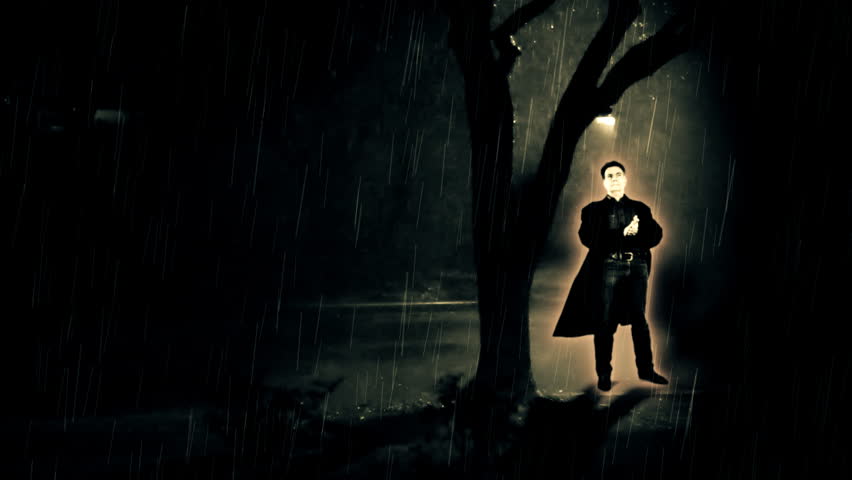 glowing Halloween creature under a tree during a rainstorm