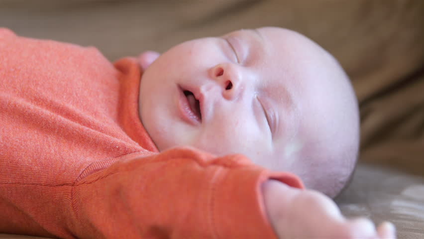 Why Do Babies Squirm In Sleep