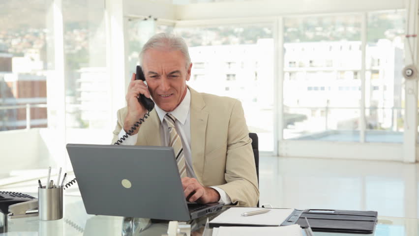 Businessman Multitasking at the Office