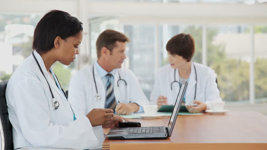 Female Doctor Multitasking on a Break