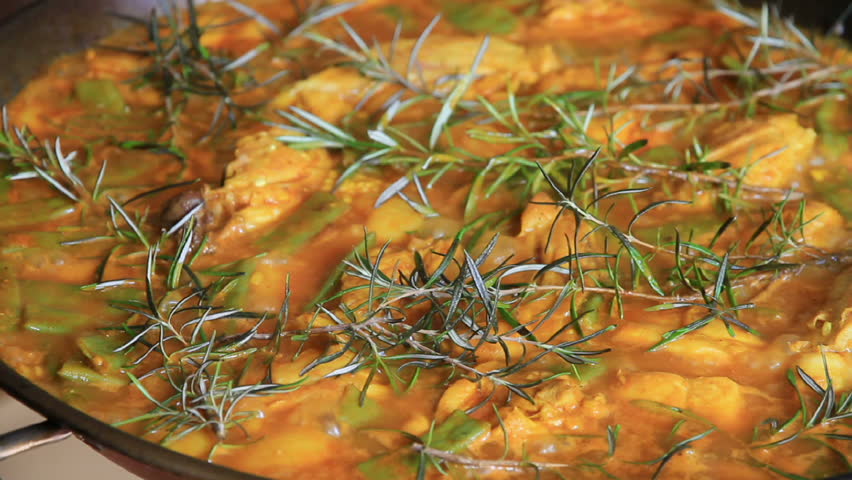 Preparing spanish typical paella with pilgrim